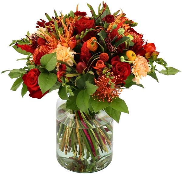 Efterårsbuket i glasvase med røde og orange blomster